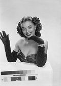 Young woman waving hand, smiling