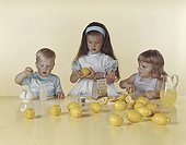Children preparing lemonade juice