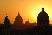 Rome, Italy.. The domes of churches silhouetted in the sunrise of a Roman Morning.