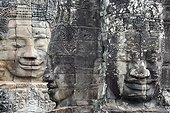 Siem Reap, Angkor, Cambodia.. Stone faces on the towers of Angkor Thom.
