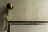 Keys hang from a lock in a door.. Allen Island, Maine, USA.