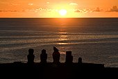 Chili Chile/Valparaíso, Easter Island Sunset on the site of AhuTahai, on the island's western shore, with five moai (Ahu Vai Uri) all very different from each other both in scale and shape