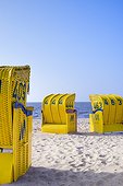 Germany, Lower Saxony, Cuxhaven, Typical roofed wicker beach chairs (Strandkorb) on Duhnen beach in Cuxhaven.