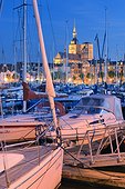 Germany, Mecklenburg-Western Pomerania, Stralsund, View across CityMarina Stralsund and hafen with St.Nikolai-Kirche in the background and yachts in the foreground.