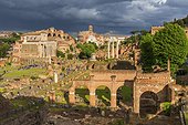 Italy, Latium, Roma district, Rome, Roman Forum, Colosseum, Sunset with dramatic clouds over the Colosseum