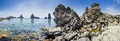Italy, Sicily, Catania district, Mediterranean sea, Aci Trezza, Ciclopi archipelago, Lachea island and Faraglioni (stack rocks)