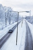 Car on snow covered road