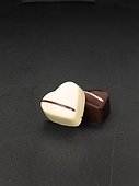 Studio shot of two heart-shaped chocolates