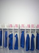 Row of blue towels hanging in rack
