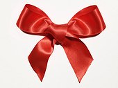Red ribbon bow against white background