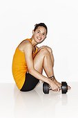 Woman in workout clothes with weight on white background