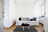 A sofa in a white living room