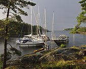 Yachts moored in small bay