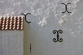 Iron decorations on house wall
