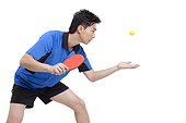 Table tennis player gets ready to serve the ball