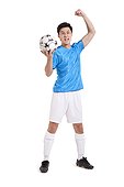 Soccer player with arm raised into a balled fist