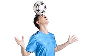 Soccer player balancing a ball on his head