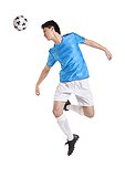 Soccer player jumping, kicking behind him