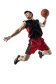Man jumping to shoot basketball
