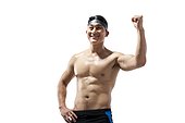 Muscular swimmer raising his fist