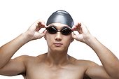 Swimmer fixing his goggles