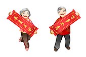 Senior couple holding Chinese New Year couplets