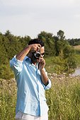 Man Taking Picture with Vintage Camera, Ontario, Canada
