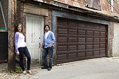 Portrait of Young Couple Standing in Alleyway, Toronto, Ontario, Canada