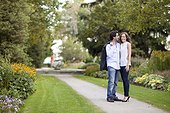 Portrait of Young Couple Standing on Walkway in Park, Ontario, Canada
