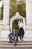 Portrait of Young Couple in front of Stone Sculptures in Park, Ontario, Canada