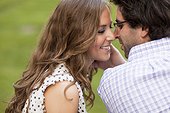 Close-up of Young Couple Kissing in Park
