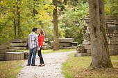 Young Couple Standing on Walkway in Park in Autumn, Ontario, Canada