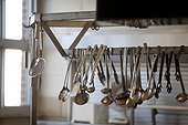 Close-up of Kitchen Utensils hanging on Rack, School Cafeteria Kitchen, Ontario, Canada