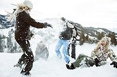 young people on winter holiday in switzerland, snowfight, having fun in the snow