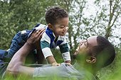 African American father and son playing outdoors