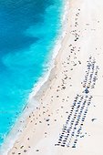 Aerial image of famous Myrtos beach from above, full of people in summer. Kefalonia, Greek Islands, Greece
