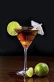 Bermuda black cocktail in martini glass against black background