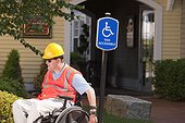 Project engineer in wheelchair at accessible parking site