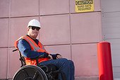 Facilities engineer in wheelchair at hard hat area