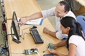 Engineering students at computer using in-circuit emulator