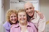 Portrait of a happy elderly mother with her daughter and daughter's husband
