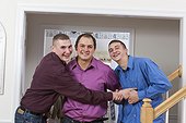 Portrait of two brothers laughing with their cousin