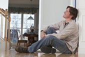 Man sitting on the floor at home
