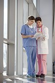 Two nurses looking at patient records