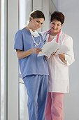 Two nurses looking at patient records