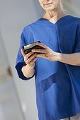 Nurse text messaging on her smartphone