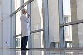 Doctor lost in thoughts at hospital window
