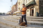 Man on a city break using digital tablet