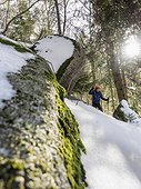 Low angle view of a Girl snowshoeing in Black Forest, Germany, Europe