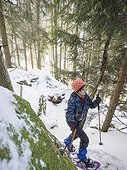 High angle view of a Girl snowshoeing in Black Forest, Germany, Europe